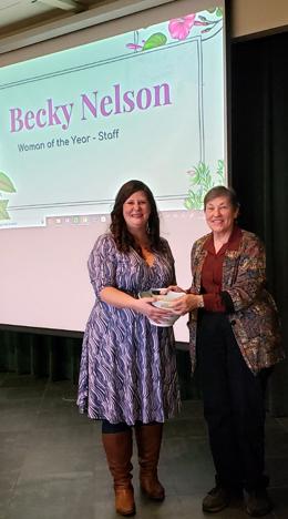 Photo: Becky Nelson receiving award from Linda Lawson
